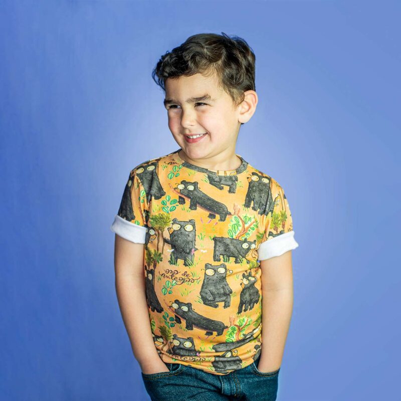 Boy wearing a Cozy, Comfy, and Adventure-Ready t-shirt