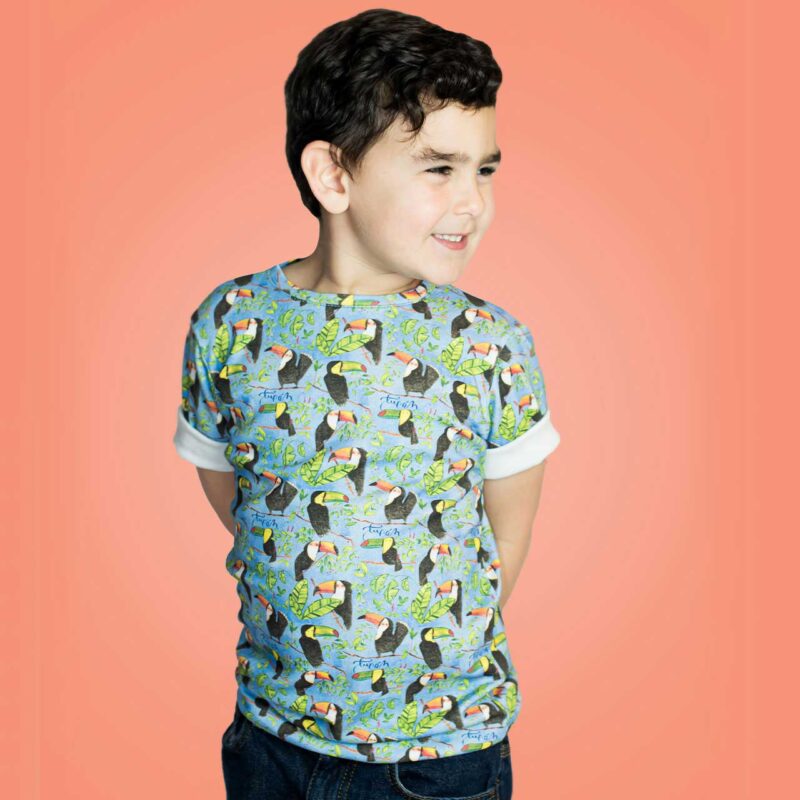 boy wearing a caribe colorful toddler t-shirt