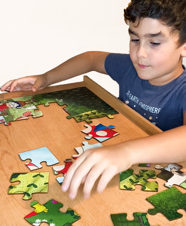 Kids puzzles, kid doing a puzzle