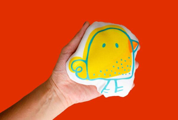 a hand holding a boo boo beanbag